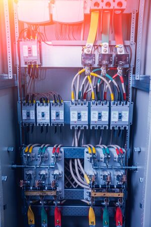 Wires and switches in electric box. Electrical panel with fuses and contactorsの写真素材