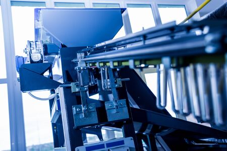 The plastic bottle blowing machine. PET preforms for blowing of plastic bottles.の写真素材