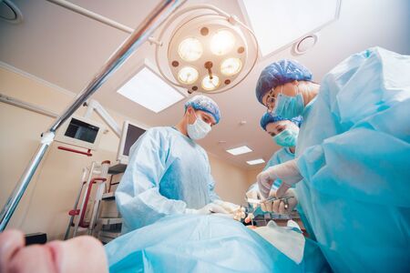 Group of surgeons in operating room with surgery equipment. Backgroundの写真素材