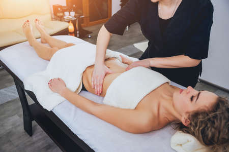 Young girl is relaxing in the spa.の写真素材