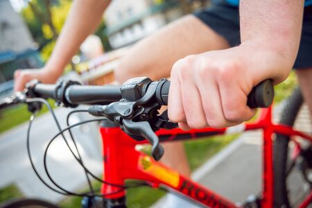 Girl on a walk at the park. On bicycleの写真素材