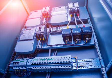 Wires and switches in electric box. Electrical panel with fuses and contactors. Background and...