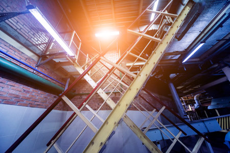 Interior of modern natural oil factory. The piping, pumps and motors