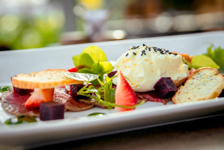 Smoked meat with vegetables and croutons on a white plate. The Restaurant