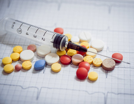Medications. Pills and syringes. Concept medical background