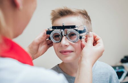 Trial frame. Glasses for a little boy. Ametropia correction with glasses.の写真素材