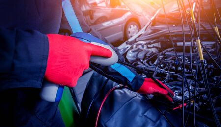 Servicing car air conditioner. Auto service station backgroundの写真素材