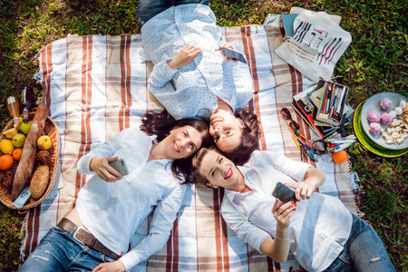 Sunny image of best friend girls taking selfie