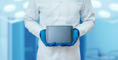 Doctor holding blank screen tablet computer. Pharmacyの写真素材