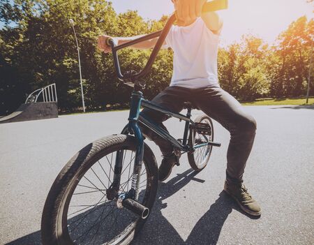 Bmx rider performing tricks at skatepark. Background.の写真素材
