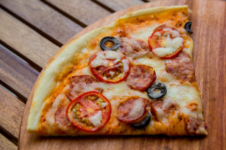 Large pizza on a wooden table. Restaurant