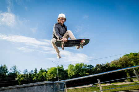 Skatboarder practicing and jumping on the streets.