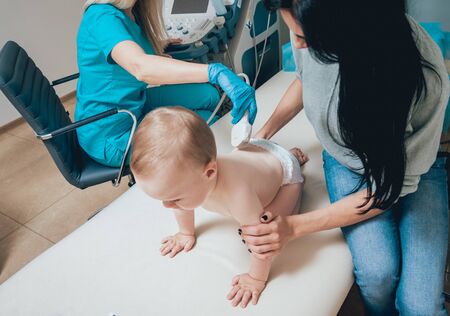 Doctor and little boy patient. Ultrasound equipment. Diagnostic sonography.の写真素材