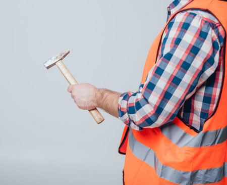 Hands holding tools for home renovation. Concept
