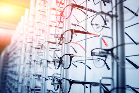 Glasses on the shelf. Ophthalmology room. Modern ophthalmic equipment. Backgroundの写真素材