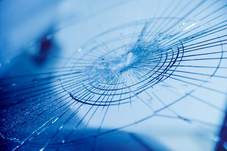 Automobile special workers remove old windscreen or windshield of a car in auto service station garage. Backgroundの写真素材