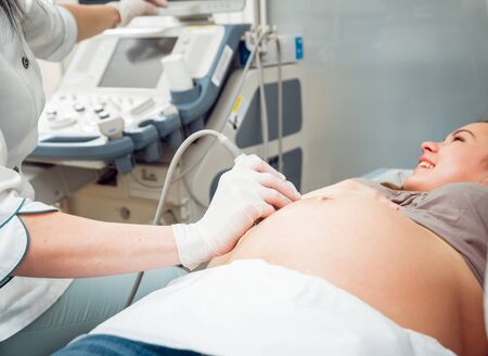 Doctor and patient. Ultrasound equipment. Diagnostics and Sonography.の写真素材