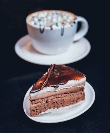 Chocolate cake on dark background. Restaurant backgroundの写真素材
