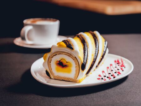 Dessert with cream on the wihte plate. Restaurantの写真素材
