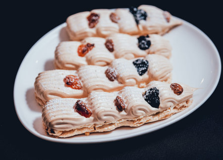 French meringue cookies on the white plate. Restaurant