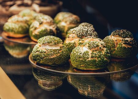 Sweets and cakes in showcase. Italian pastry shop. Cakes with fruitsの写真素材