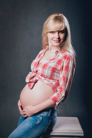 Picture of beautiful pregnant woman. Studio shooting.の写真素材