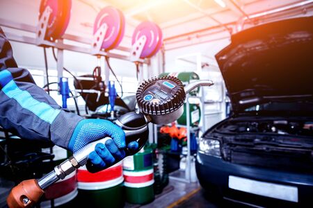 Engine oil change. Car repair. Auto backgroundの写真素材