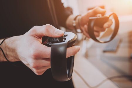 The young man plays a game at the office.の写真素材