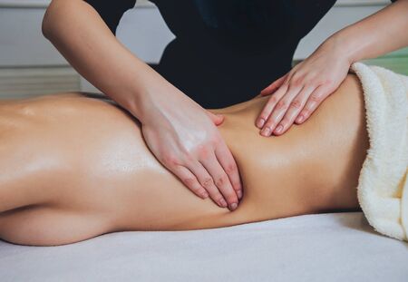Young girl is relaxing in the spa.の写真素材