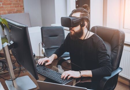 The young man wearing virtual reality gogglesの写真素材