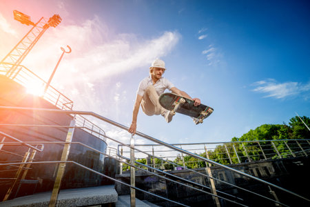 Skatboarder practicing and jumping on the streets.