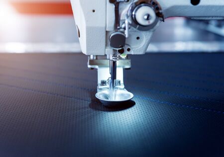 Fabric industry production line. Textile factory. Working tailoring process cloth. Modern equipmentの写真素材