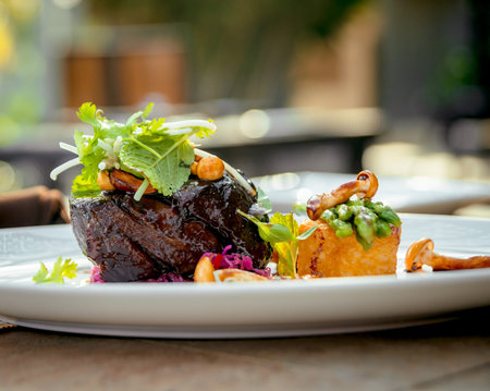 Meat with potatoes and asparagus on a white plate. The Restaurantの写真素材