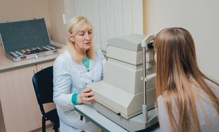 Consultation with an ophthalmologist. Eye examination at the clinic.の写真素材
