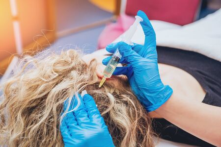 Beautician and the patient in the clinic of aesthetic medicine.の写真素材