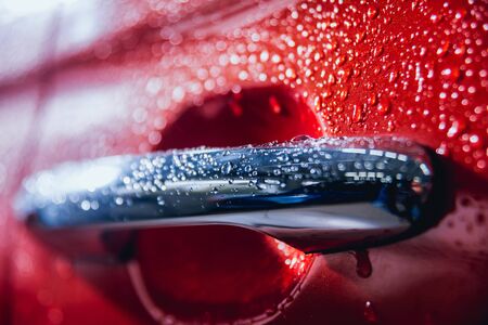 Details of electric car. Door handle and rain drops.の写真素材