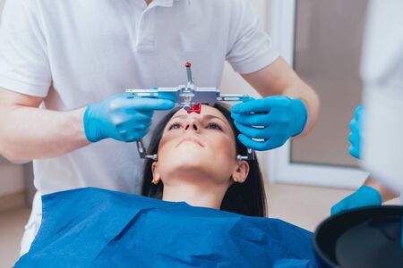 Installation of the face-bow. Functional diagnostics. Modern technologyの写真素材