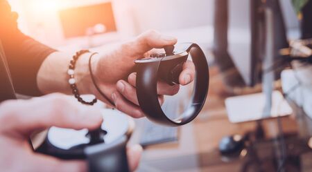 The young man plays a game at the office.の写真素材