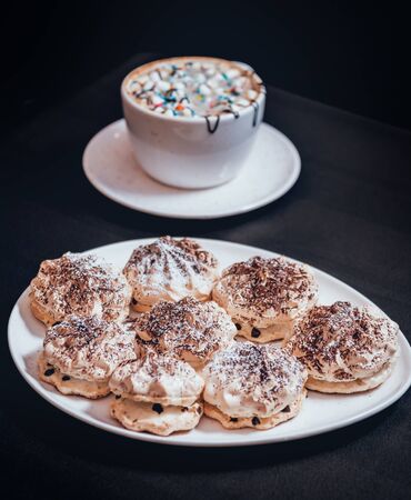 French meringue cookies on the white plate. Restaurantの写真素材