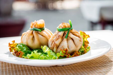 Pancakes with filling on a white plate.の写真素材