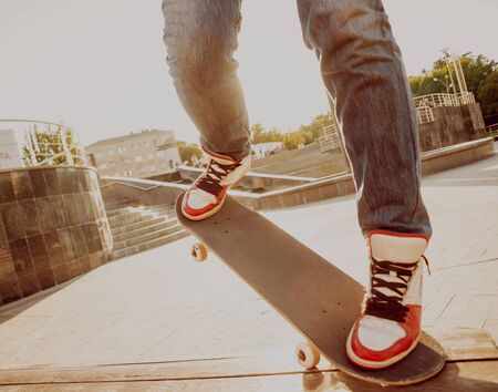 Young man riding a skateboard. Town Squareの写真素材