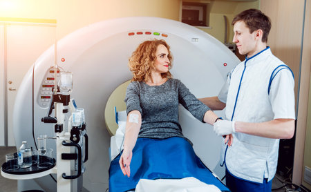 Medical equipment. Doctor and patient in the room of computed tomography