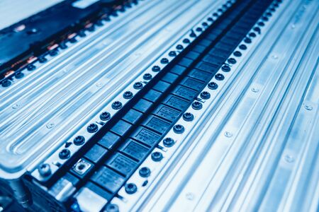 Charging the batteries of the elecric motor. Disassembling the battery of an electric vehicle engine. Car serviceの写真素材