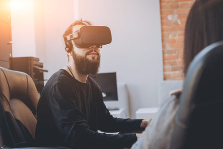 The young man with girlfriend plays a game at the office.