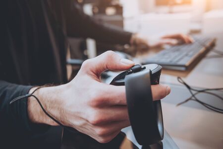 The young man plays a game at the office.の写真素材