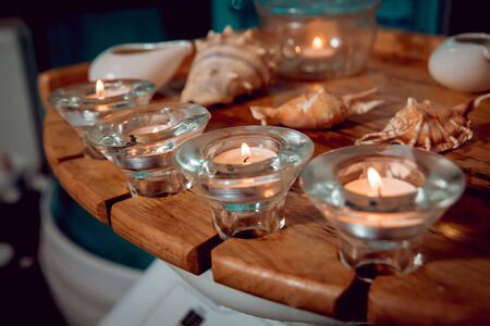 Aroma candles with shells on the table.の写真素材