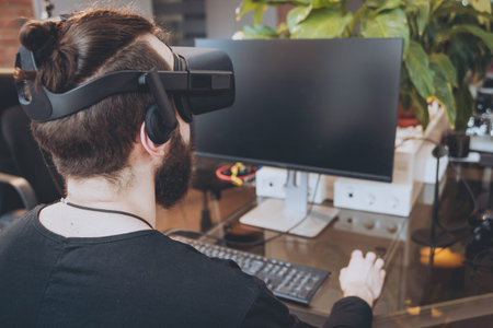 The young man wearing virtual reality goggles