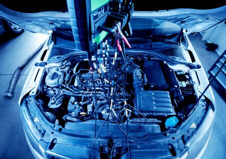 Service station. Car repair wiring. Engine Auto service backgroundの写真素材