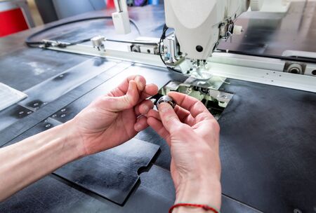 Fabric industry production line. Textile factory. Working tailoring process cloth. Modern equipmentの写真素材