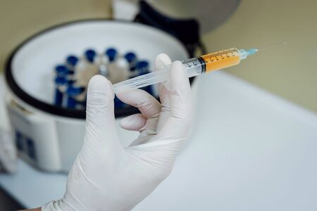 Platelet-Rich plasma preparation. Plasma in syringe. Centrifuge.の写真素材
